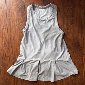 Girls Sleeveless dress with Pleated Hem. Size 4